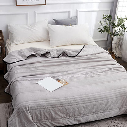 Plaid léger pour les nuits chaudes et les déplacements