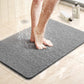 Tapis de douche antidérapant à structure drainante