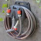 Support de tuyau d'arrosage mural