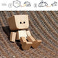 Figurine en bois basculante à visages interchangeables