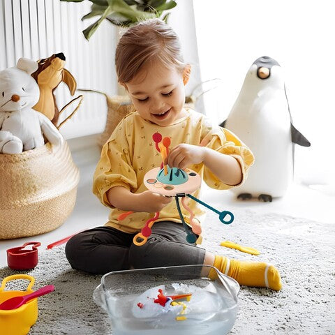 Jouet sensoriel soucoupe à 6 cordons en silicone et ABS