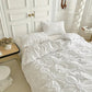 Housse de couette à plis et rosettes avec taies assorties