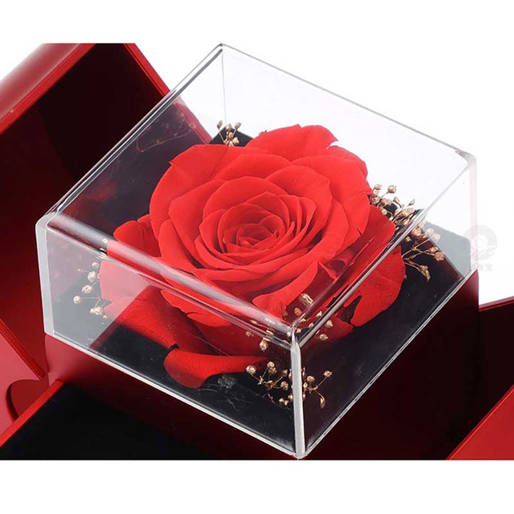 Coffret à bijoux en forme de pomme avec rose et collier