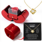 Coffret à bijoux en forme de pomme avec rose et collier