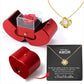 Coffret à bijoux en forme de pomme avec rose et collier