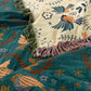 Plaid décoratif réversible bleu sarcelle et crème à franges