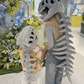Coiffe de dinosaure squelette en peluche avec queue