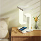 Lampe de table rechargeable à structure suspendue et base de recharge