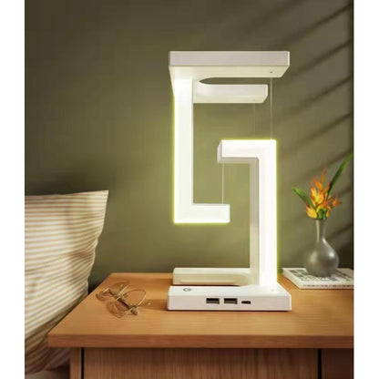 Lampe de table rechargeable à structure suspendue et base de recharge