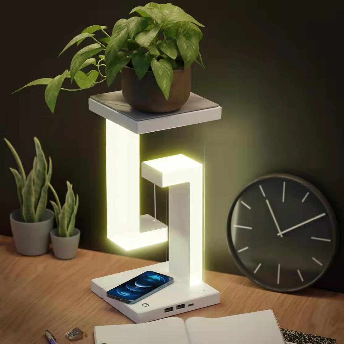 Lampe de table rechargeable à structure suspendue et base de recharge