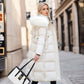 Manteau long matelassé à capuche en fausse fourrure et ceinture