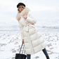 Manteau long matelassé à capuche en fausse fourrure et ceinture