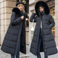 Manteau long matelassé à capuche en fausse fourrure et ceinture
