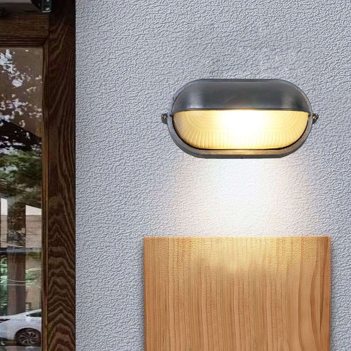 Applique extérieure ovale à diffuseur en verre rainuré