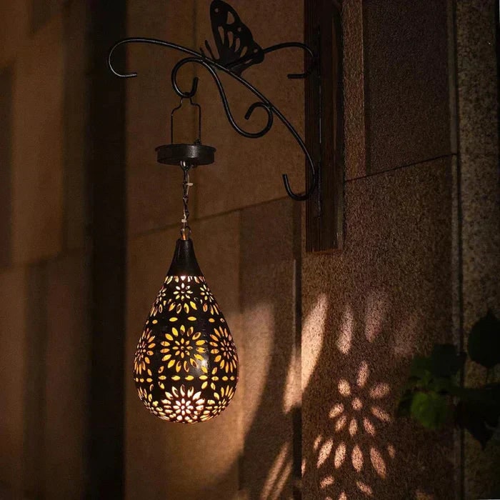 Lanterne solaire ajourée à motif floral