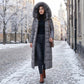 Manteau matelassé long pour femme avec capuche et ceinture