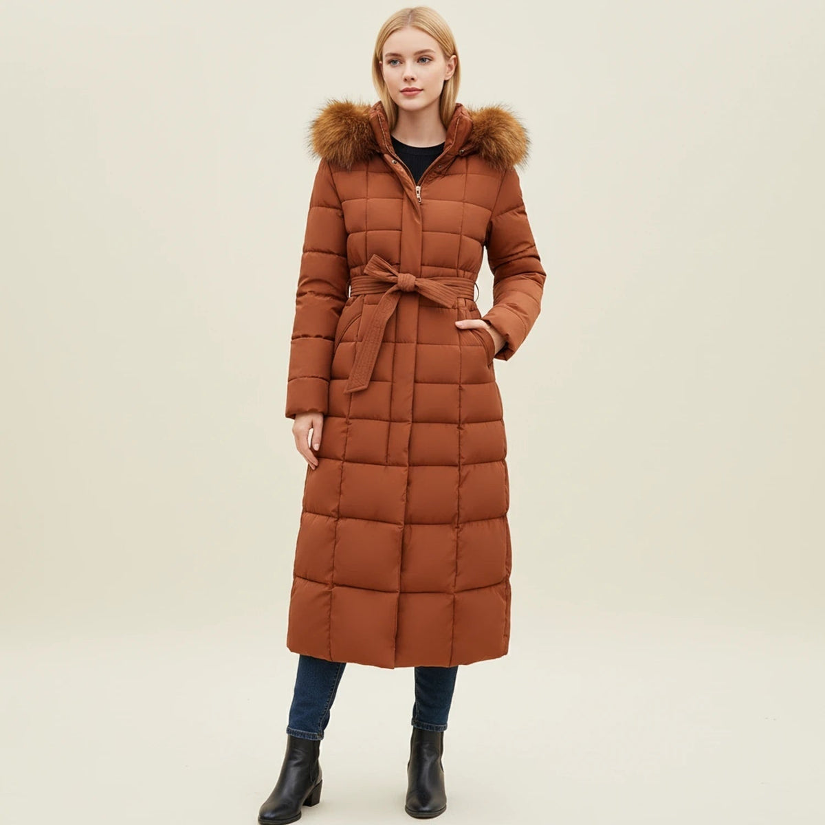 Doudoune longue pour femme avec ceinture et capuche bordée de fausse fourrure