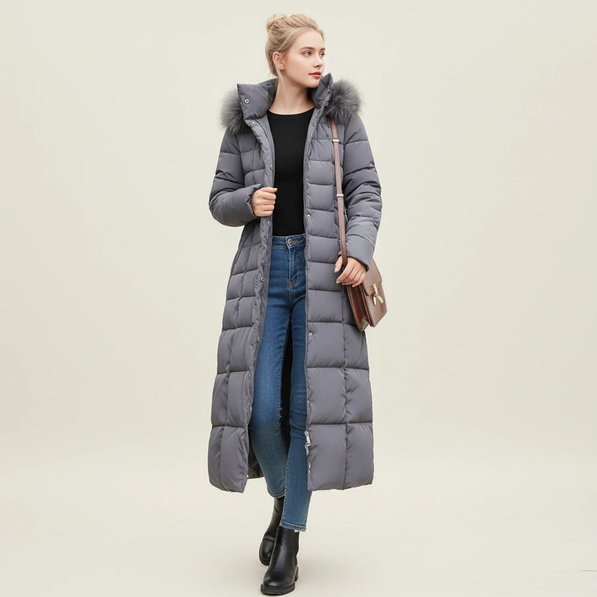 Doudoune longue pour femme avec ceinture et capuche bordée de fausse fourrure